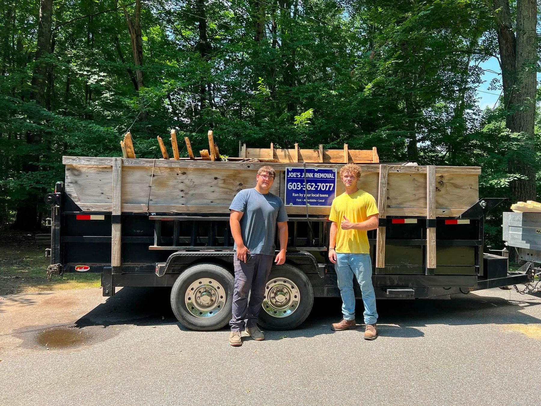 Joe and Tucker in front of the loaded dump trailer